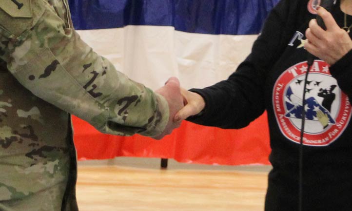 Military shaking hands with TAPS Military shaking hands with TAPS